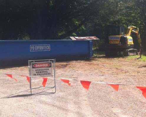 Removal of Asbestos from the soil with Excavator