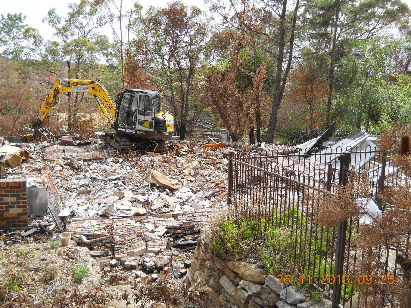 Excavator With Claw Moving Rubble And Debris